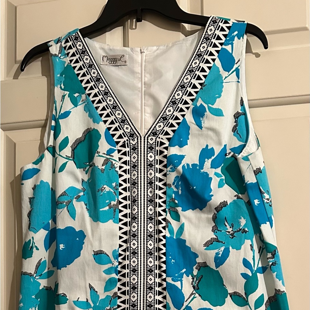 Maggie L brand; white with turquoise floral design; size M